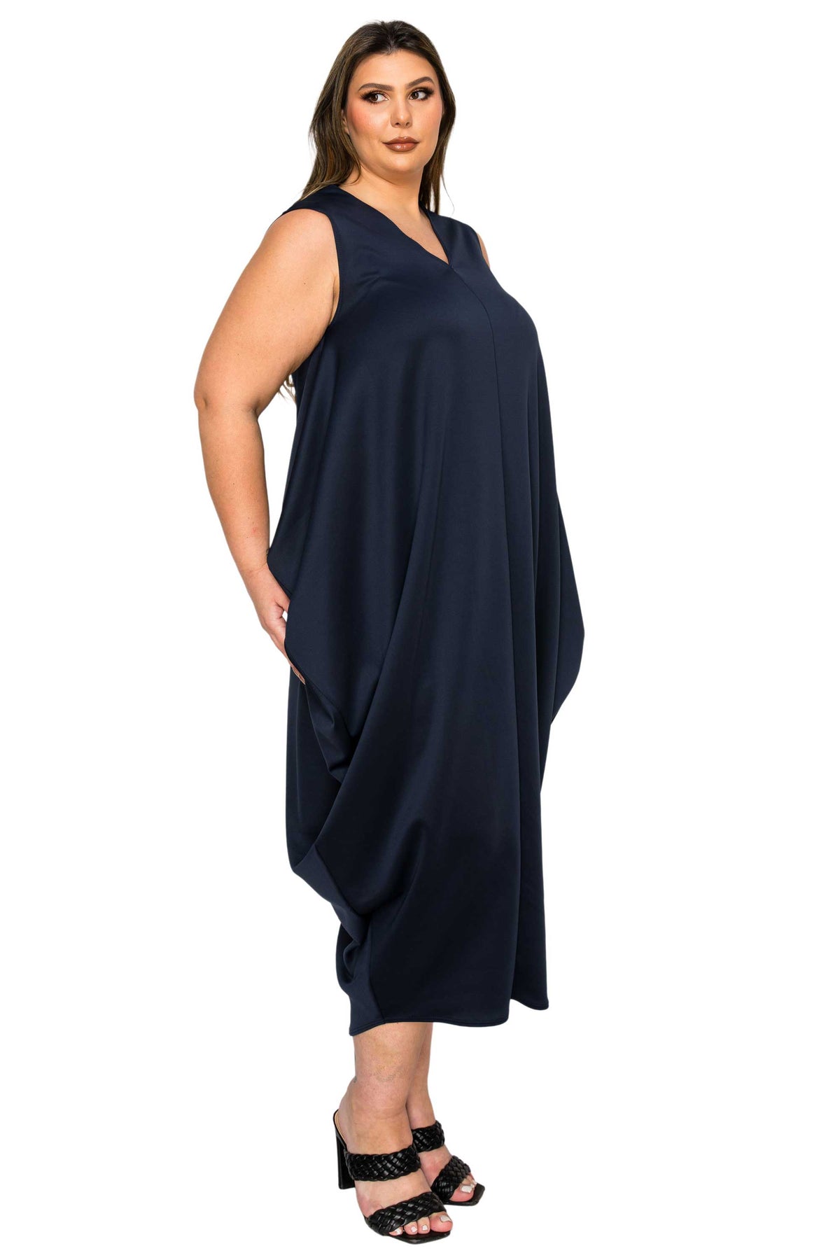 black plus size sleeveless bubble hem dress. side view