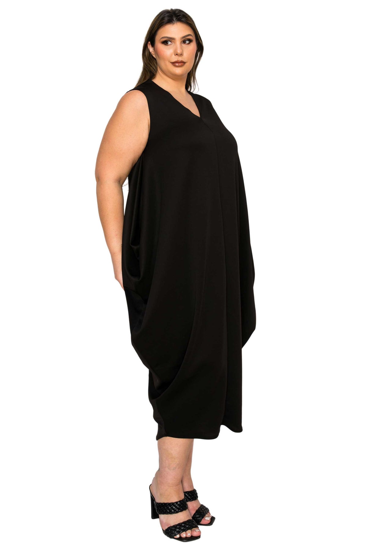black plus size sleeveless bubble hem dress. side view