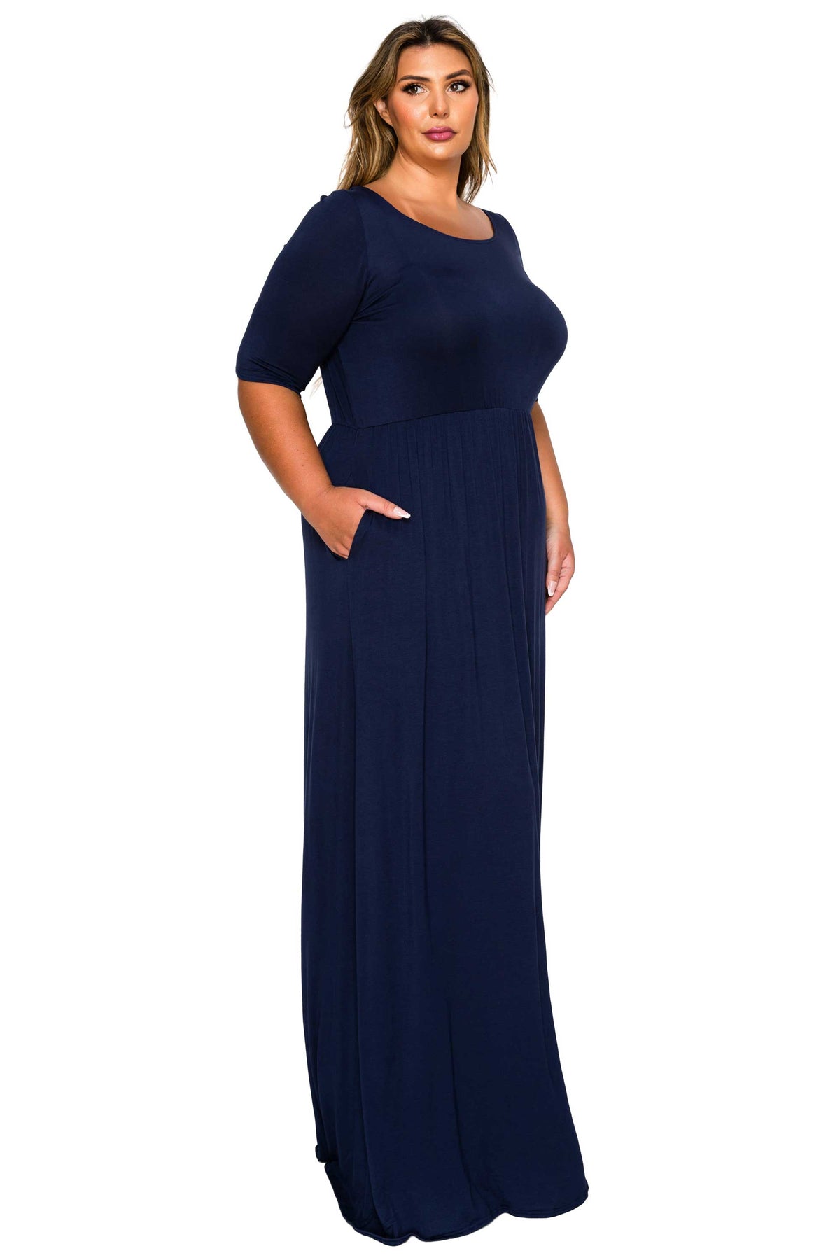 navy color plus size dress scoop neck, maxi length, three quarter sleeves with pockets. Side view