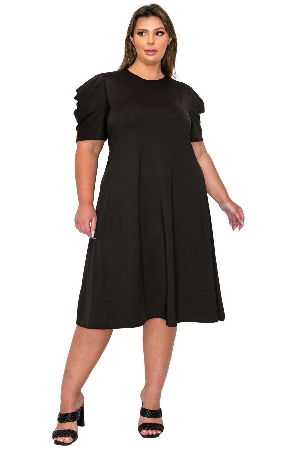 black color plus size dress, front view of model. gathered shoulders and midi flare hem