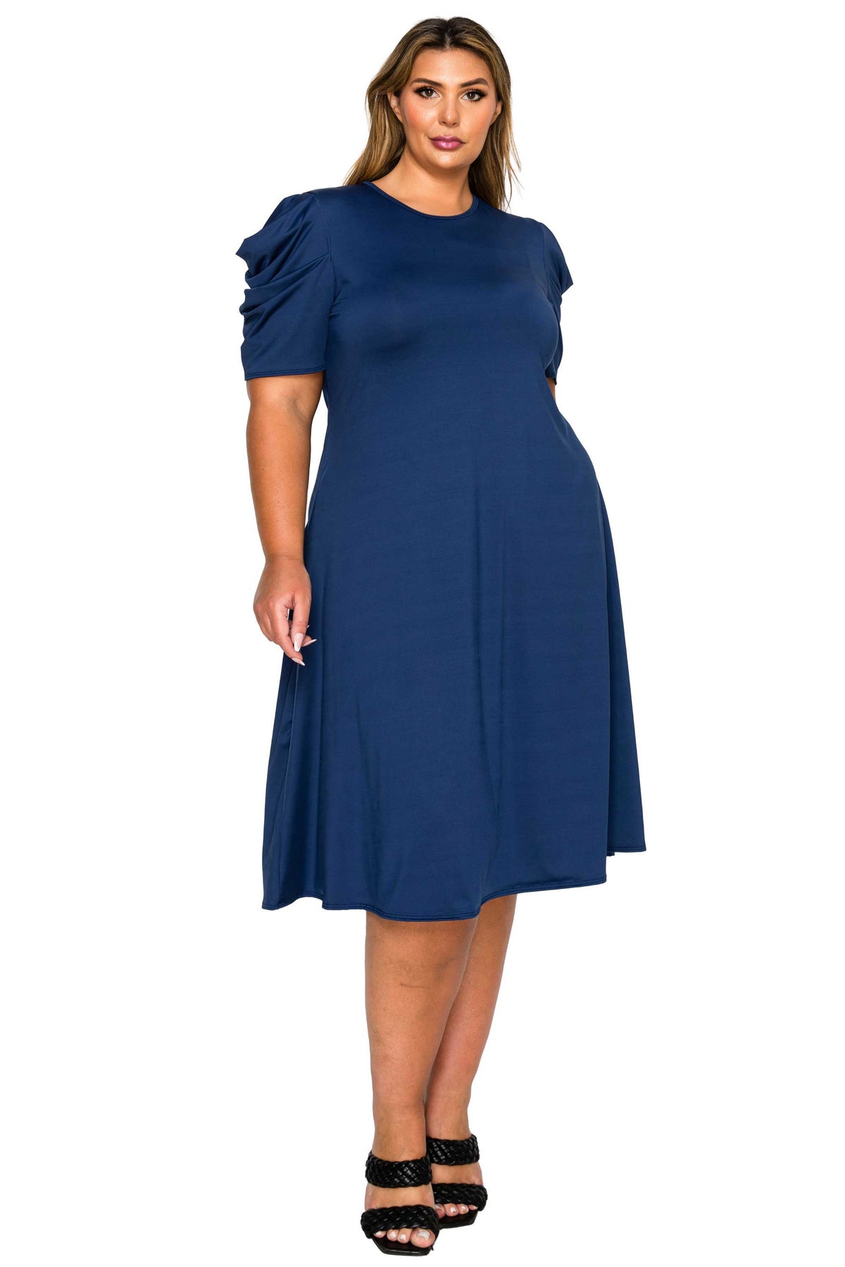 navy color plus size dress, front view of model. gathered shoulders and midi flare hem