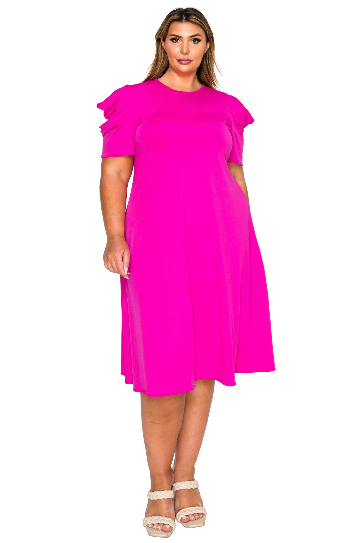 pink color plus size dress, front view of model. gathered shoulders and midi flare hem