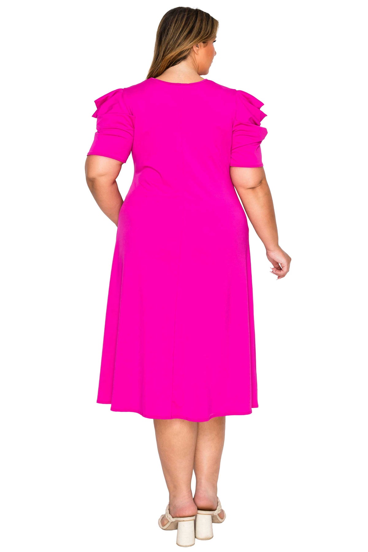 pink color plus size dress, back view of model. gathered shoulders and midi flare hem